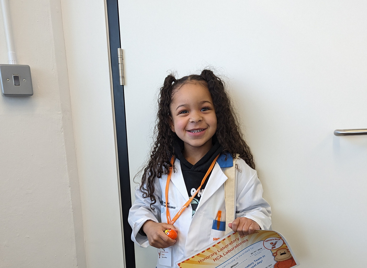 Wearing her special Harvey’s lab coat 