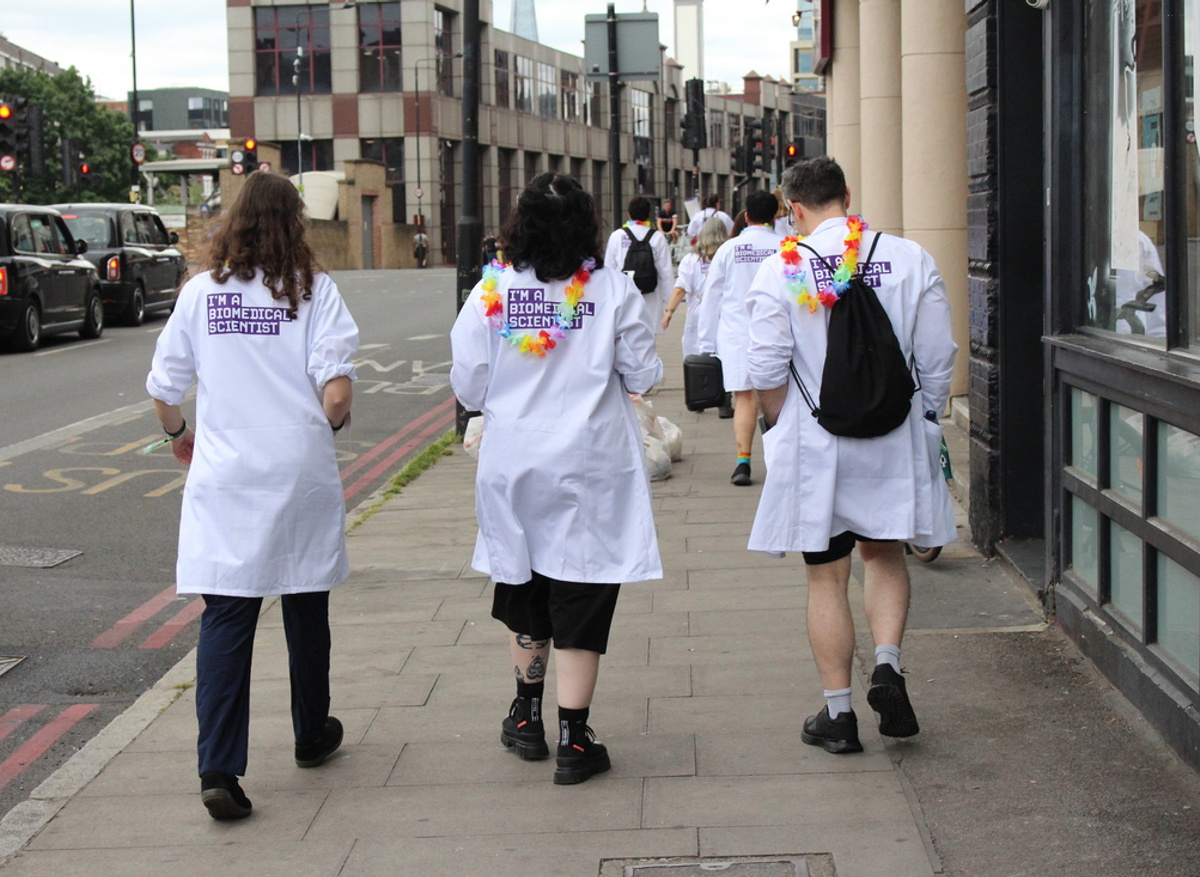 Members making their way to the Pride in London parade in their 'I'm a biomedical scientist' lab coats