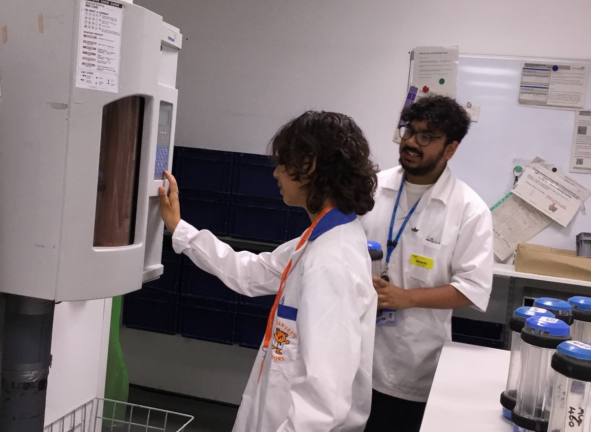 Mireille booking in a sample and loading it onto the laboratory track