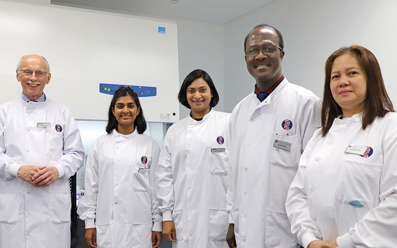 web_p50_cmyk_editv2_team-standing-up-with-labcoats-on_copy.jpg