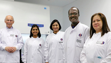 web_p50_cmyk_editv2_team-standing-up-with-labcoats-on_copy.jpg