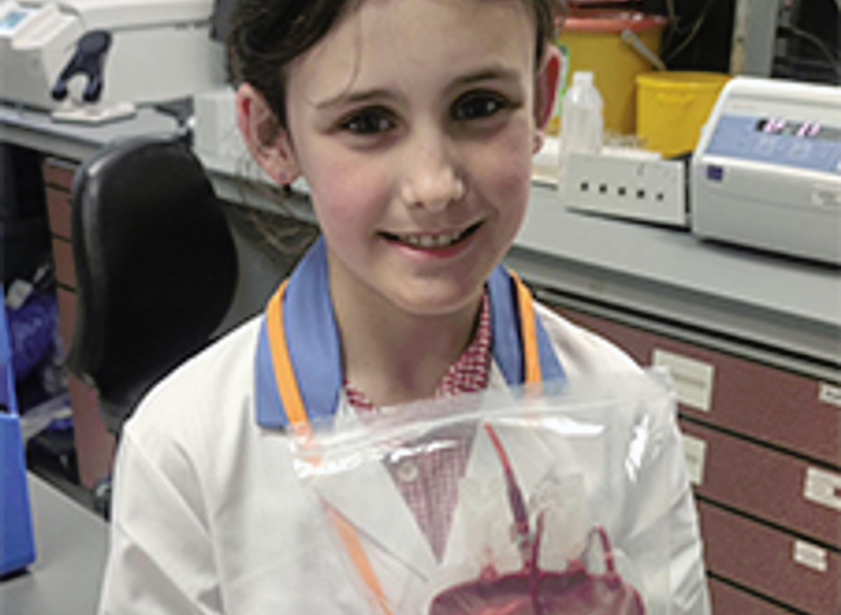 Isabella put on her name badge and lab coat, fully immersing herself in the role of a scientist. 