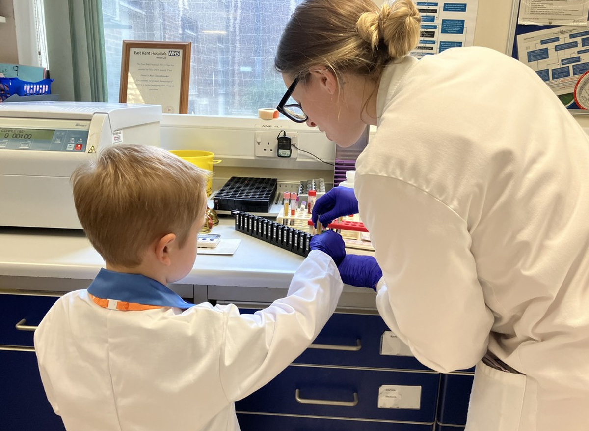 Josh loading a sample onto the blood analyser