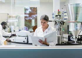 web-p34-37-eqa-lab-researcher-reading-binder-credit-istock-1646508449.jpg