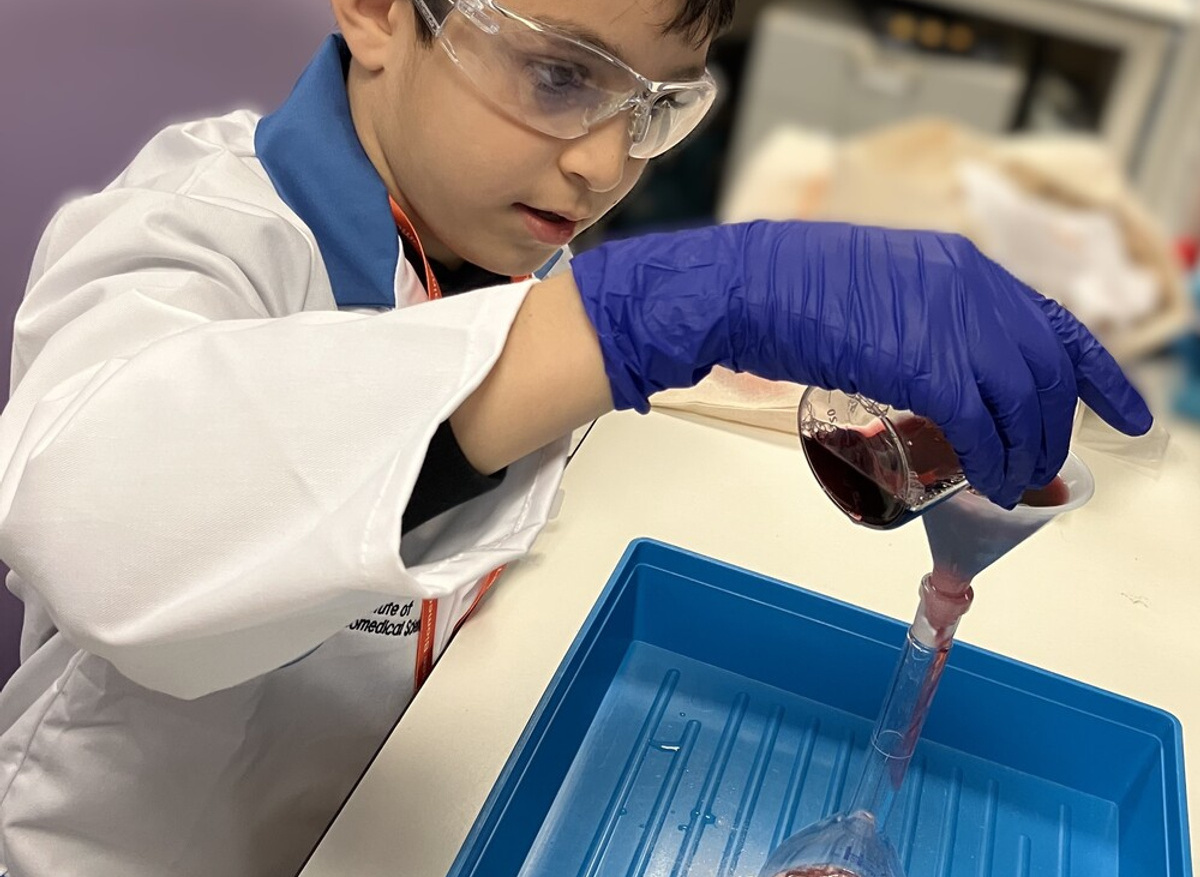 Kareem taking part in a colour change experiment